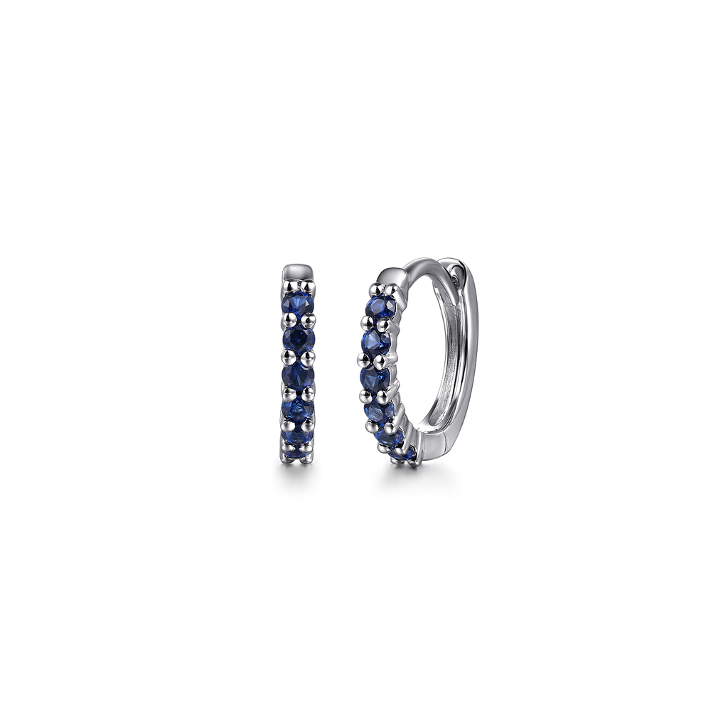 white gold hoop earrings with blue stones on white background