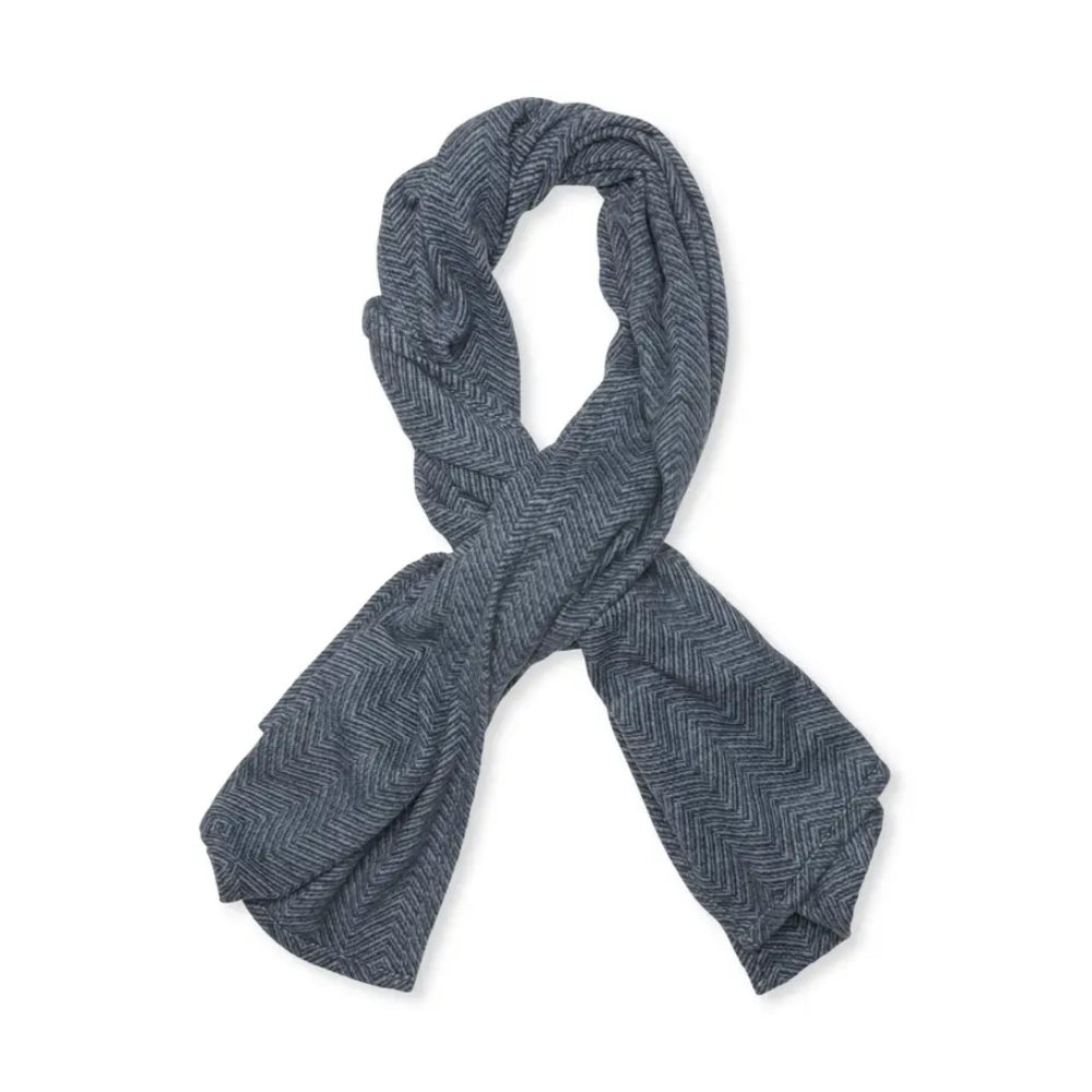 A dark gray herringbone pattern shawl, knotted in a loop and laid flat on a white background.