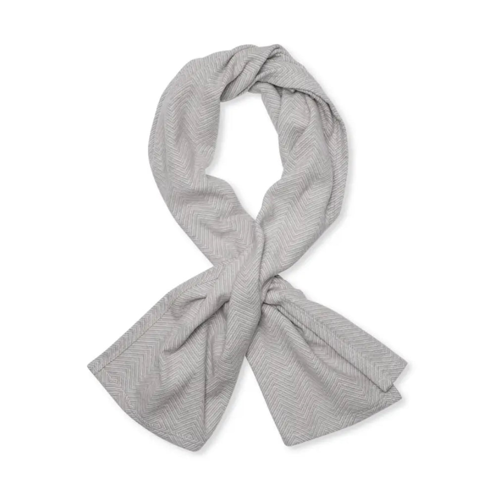 A light gray shawl with a fine herringbone pattern, styled in a loop and tied in a knot, shown on a solid white background.