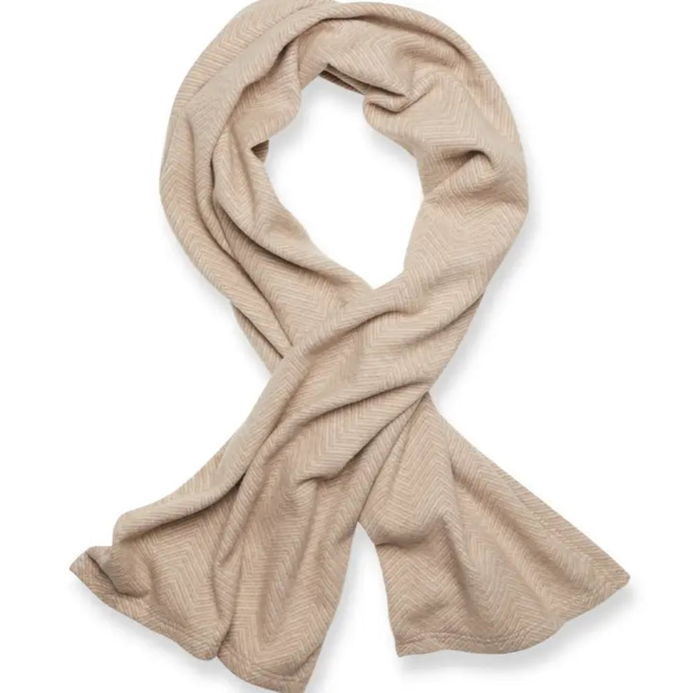 A light beige shawl with a subtle herringbone pattern, draped in a loose loop against a clean white background.