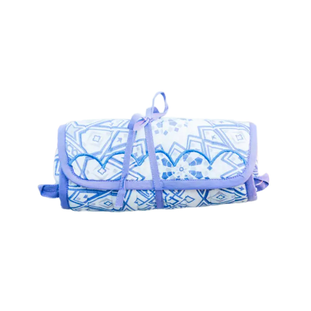 Lavender and white quilted jewelry roll with an abstract pattern on a white background