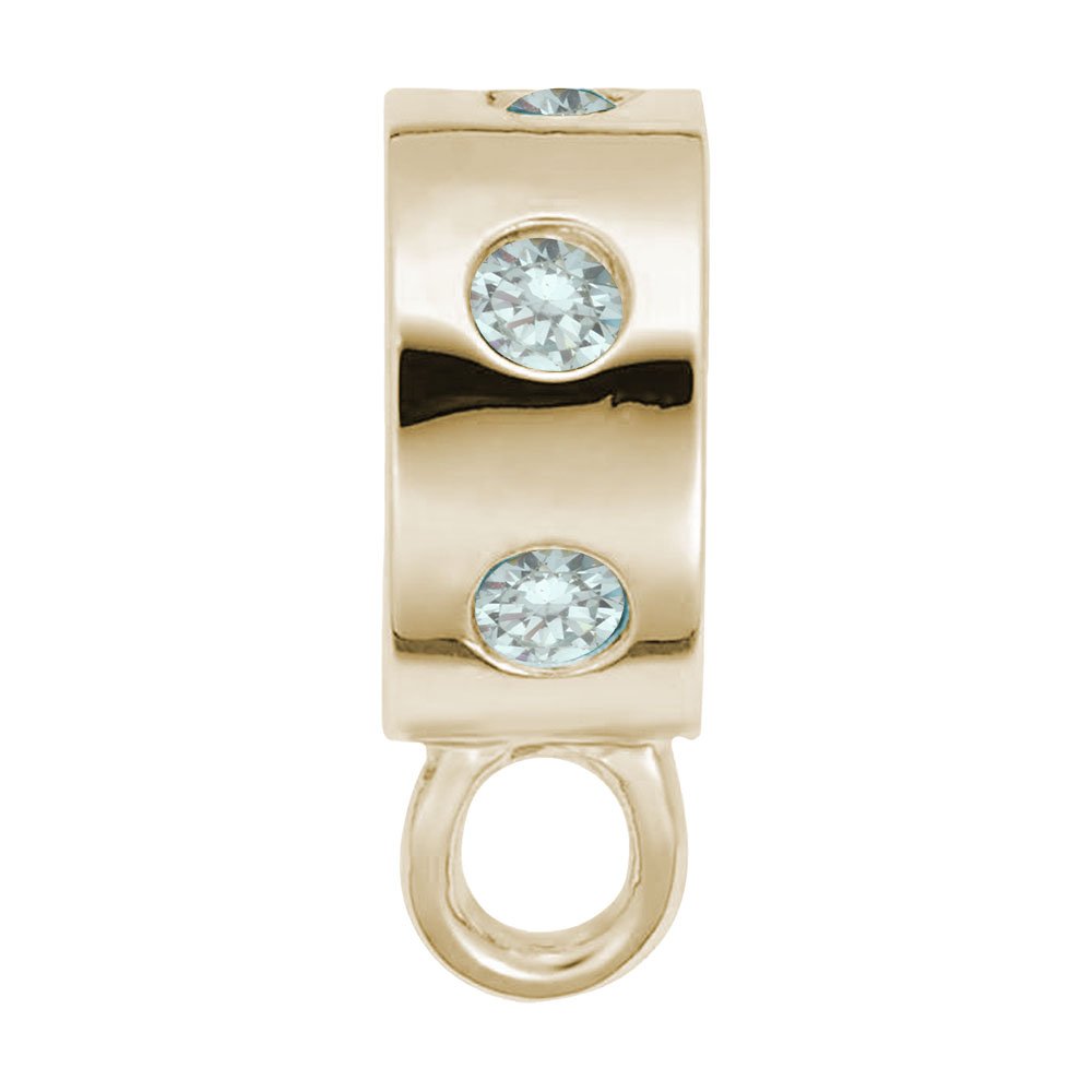 Gold charmdrop with blue stones on a white background