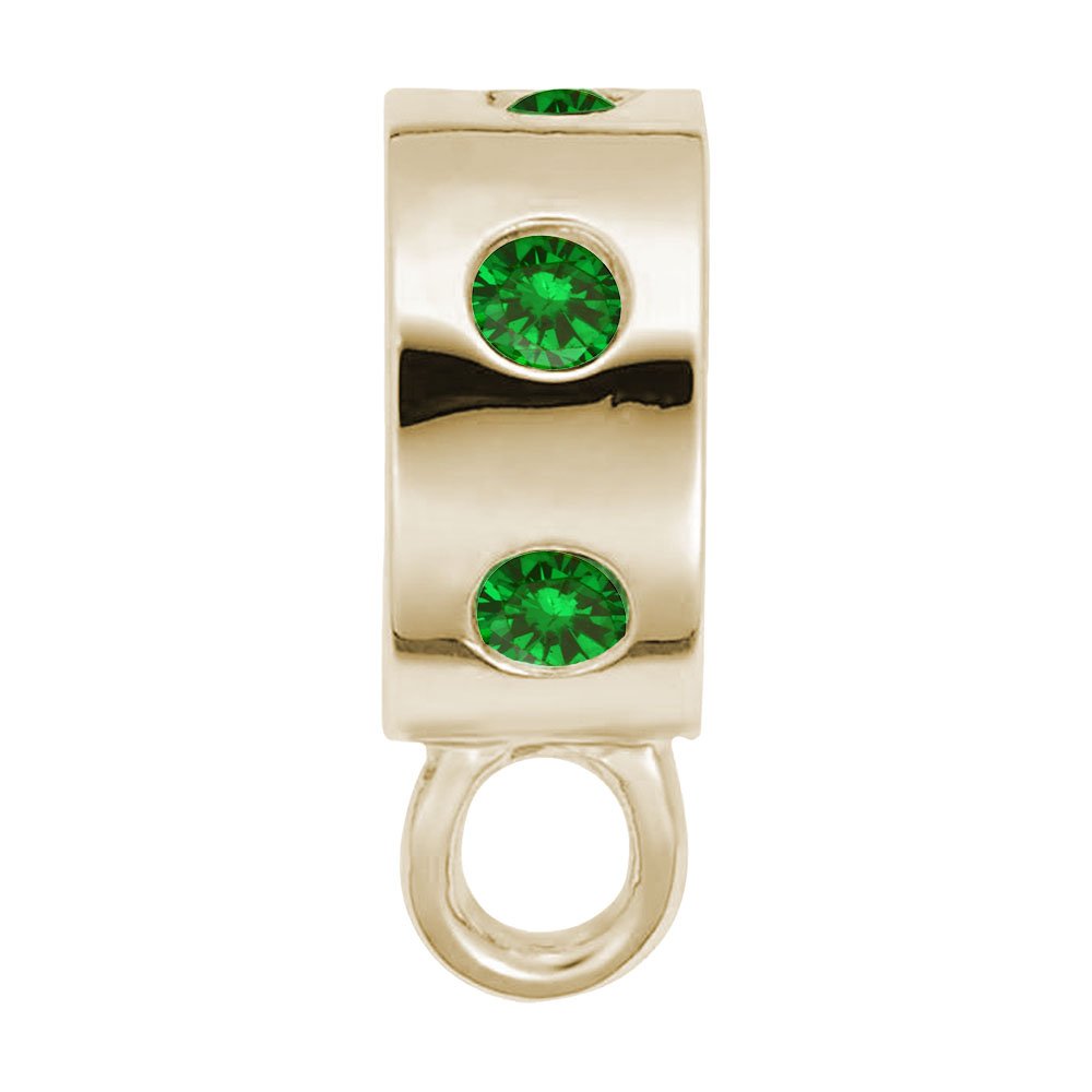Gold charmdrop with green stones on a white background