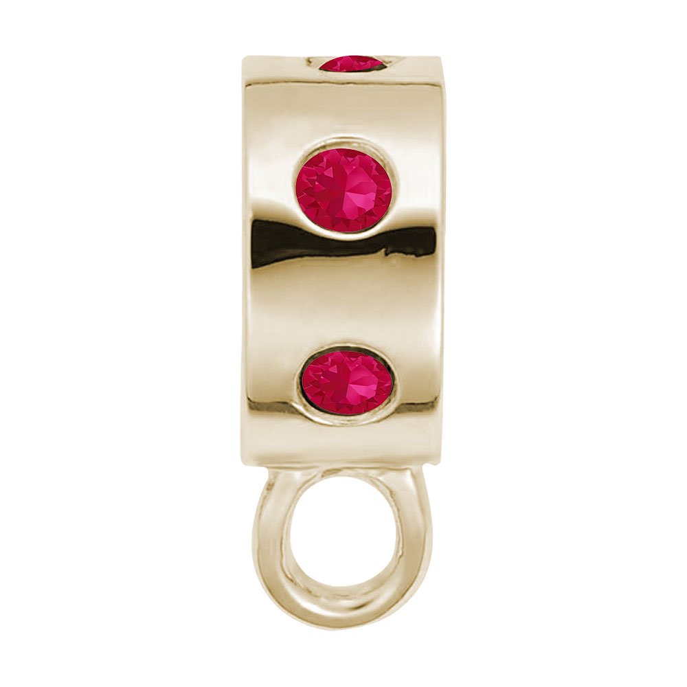 Gold charmdrop with red stones on a white background