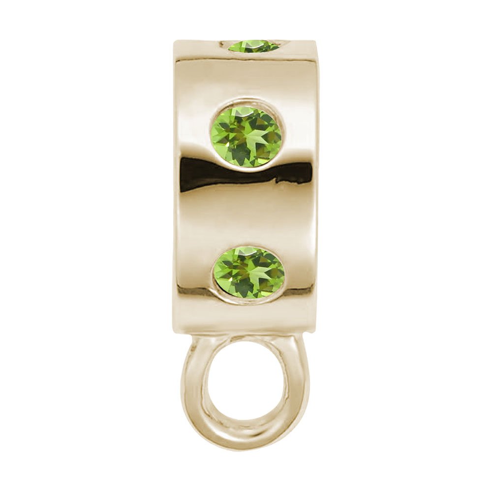 Gold charmdrop with green stones on a white background