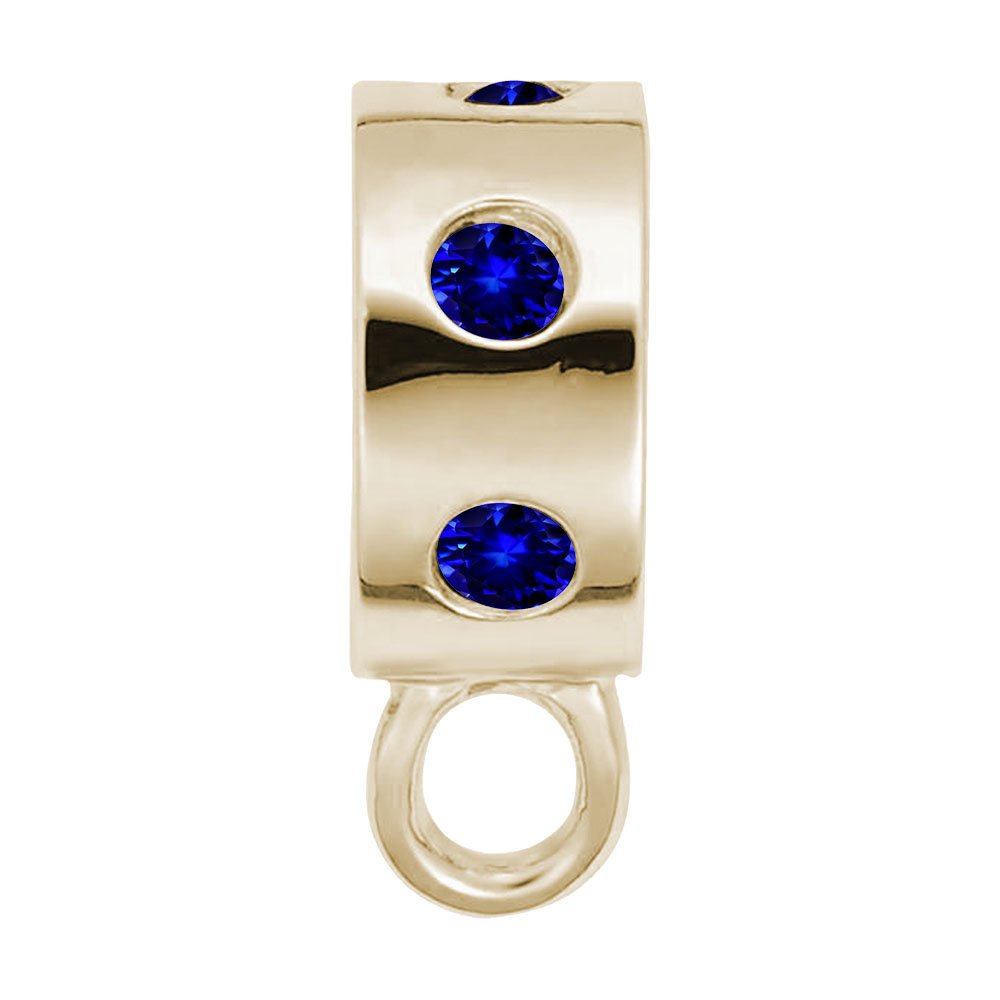 Gold charmdrop with blue stones on a white background