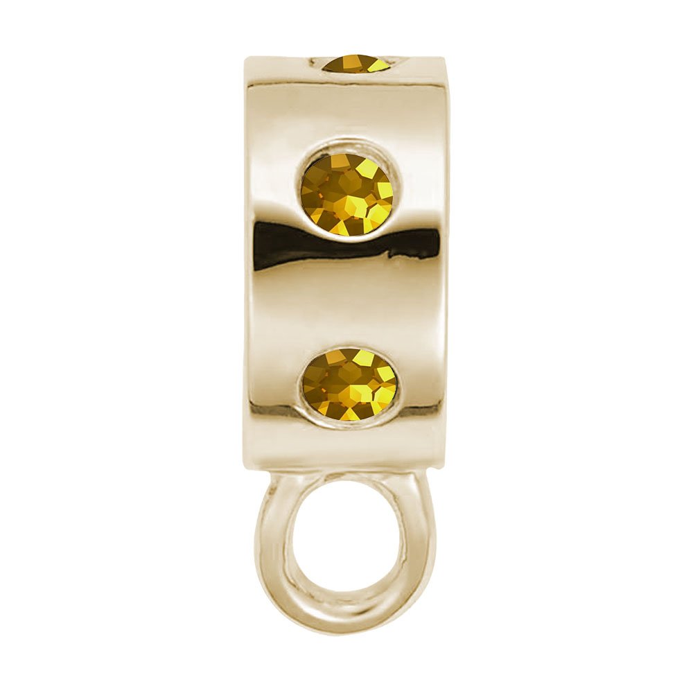 Gold charmdrop with orange stones on a white background