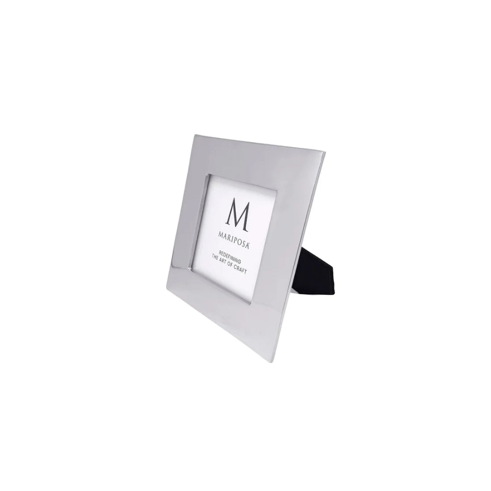 A modern square picture frame with a brushed silver metallic finish and a black stand, shown on a plain white background.