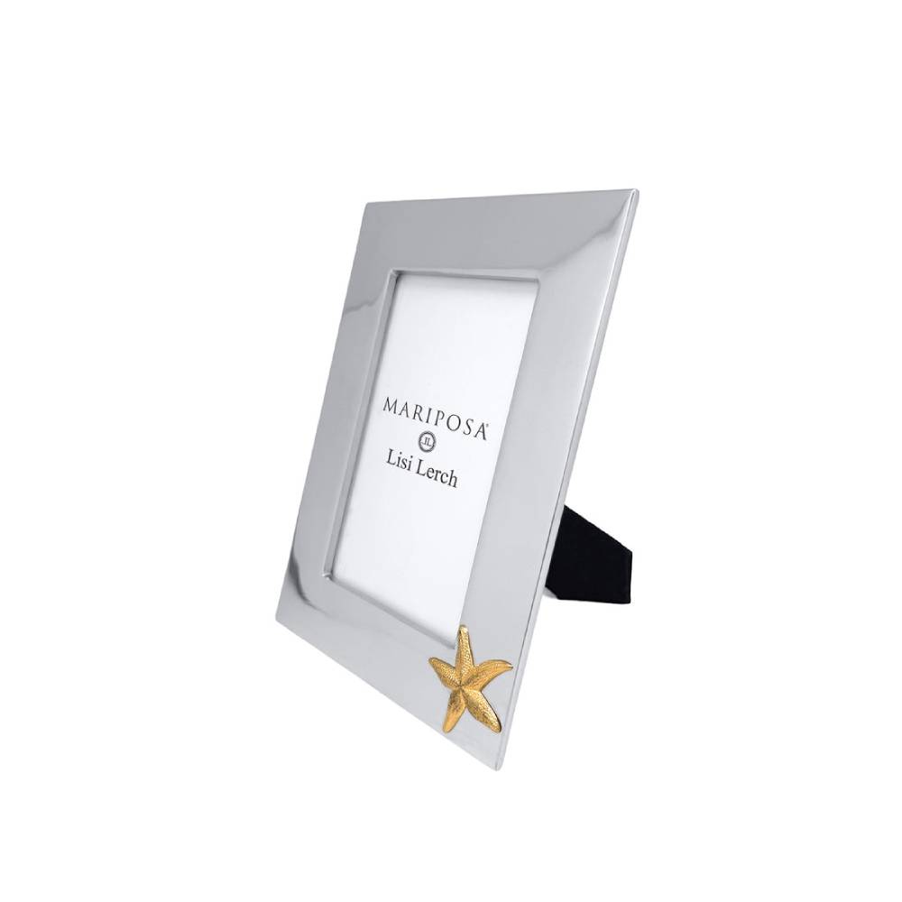 A silver picture frame with a small gold starfish accent at the bottom corner, shown on a plain white background. The insert card features the text 'MARIPOSA Lisi Lorch'.