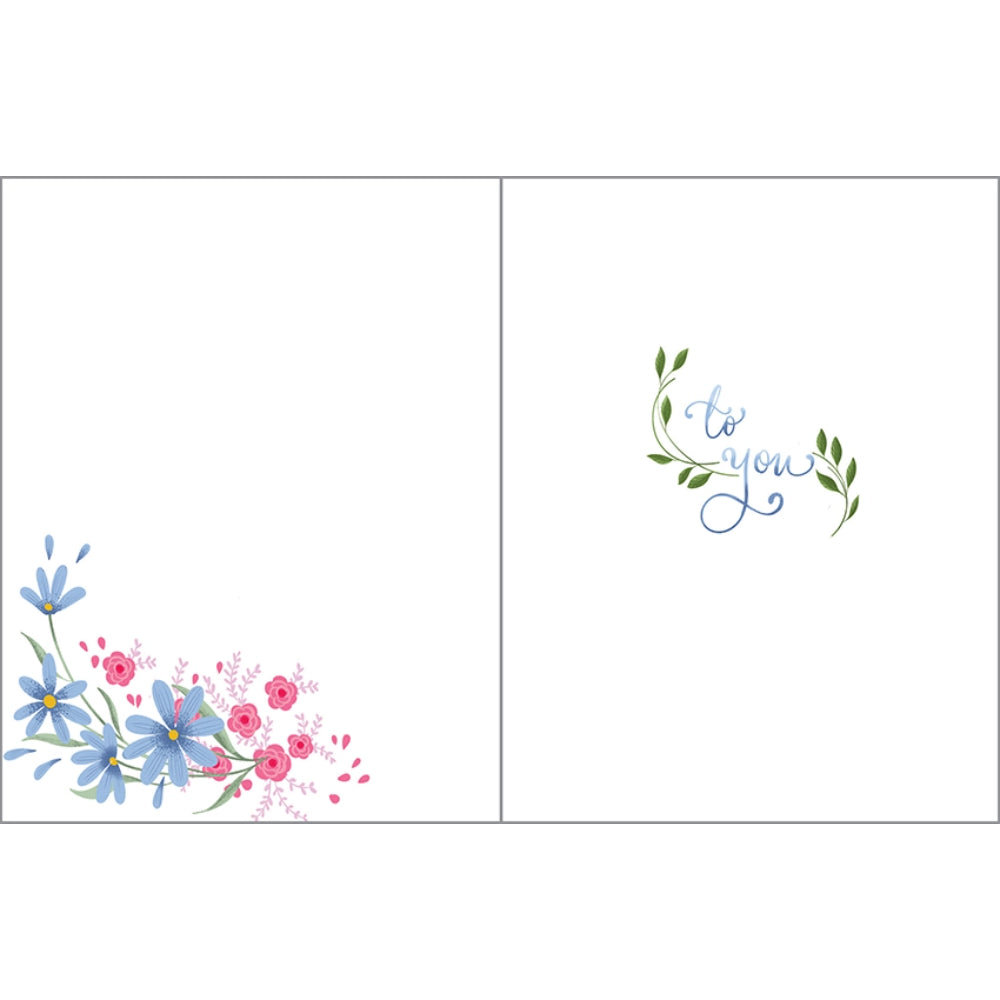 text "to you" on birthday greeting card with floral designs. 