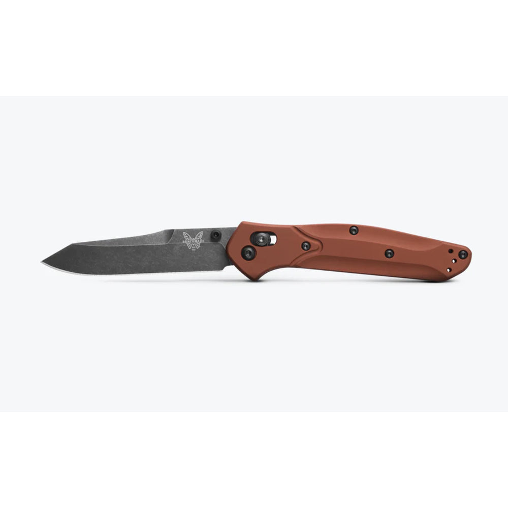 A folding pocket knife with a dark gray steel blade and a textured reddish-brown handle, shown open against a light gray background.