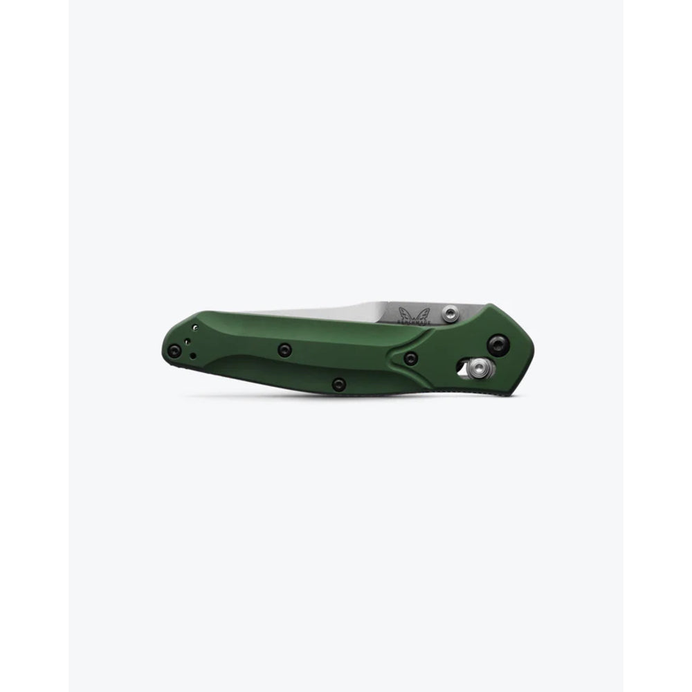 A folding pocket knife with a dark green handle and a partially visible silver blade, shown in a side profile on a light gray background.