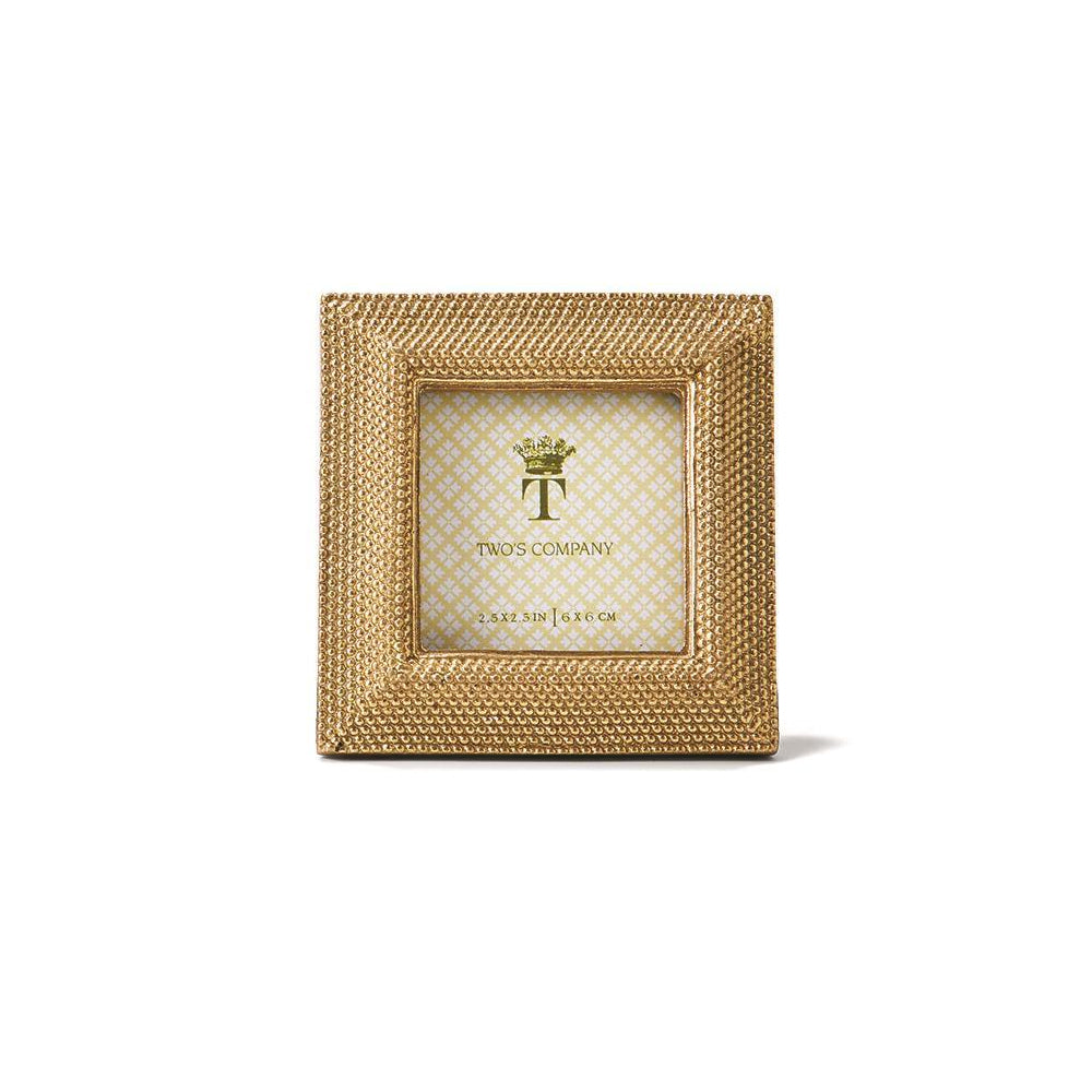 Square 2.5 x 2.5 golden picture frame on a white backround. 