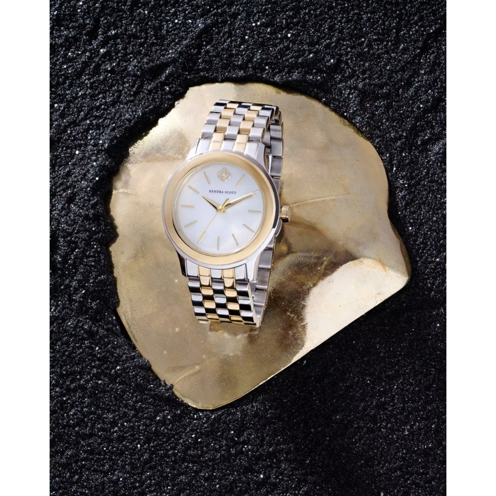 Two-tone watch on a textured black surface