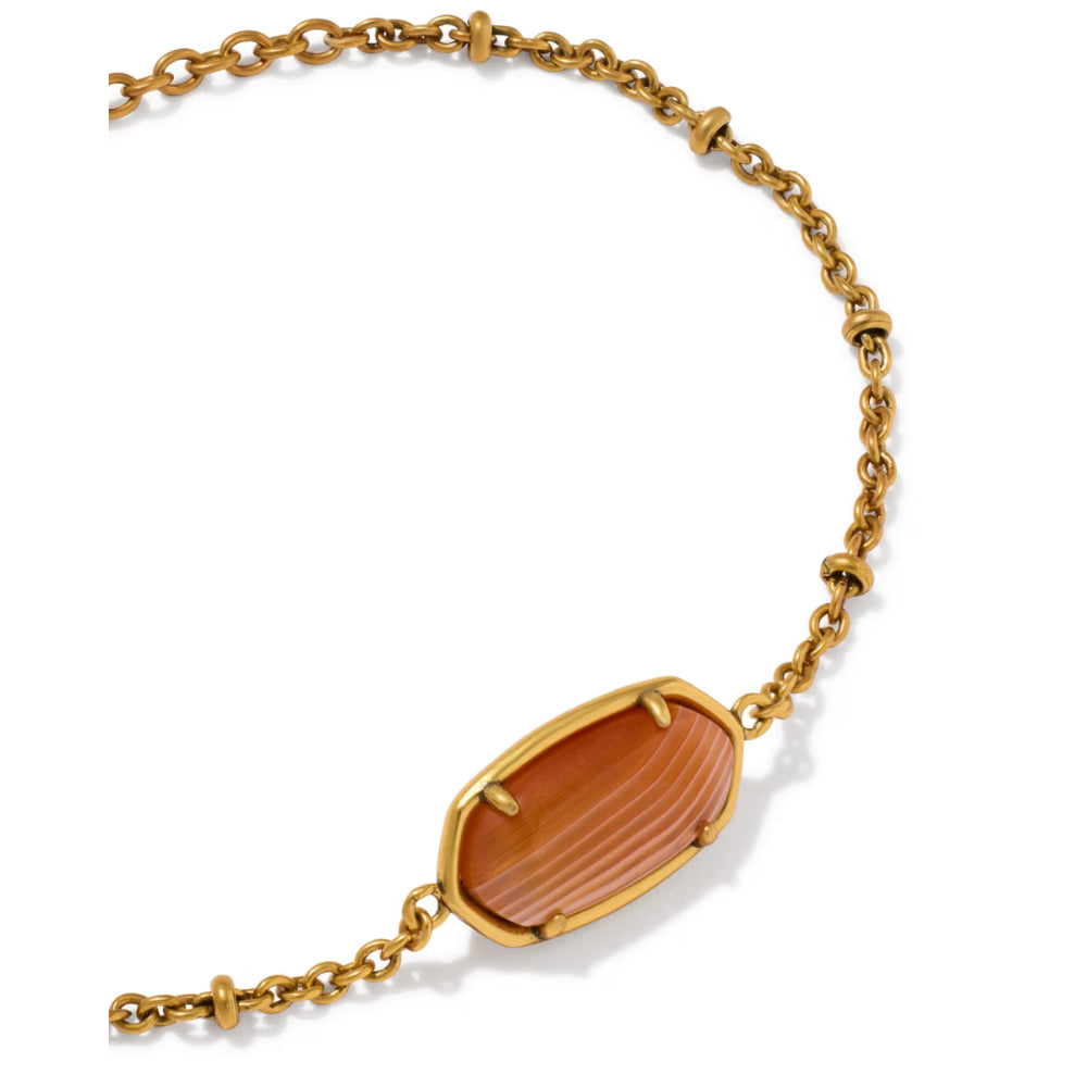 A gold chain necklace featuring a central marquise-shaped cabochon stone with a warm orange-brown gradient and fine horizontal striations, set in a gold bezel. Photographed on a clean white background.