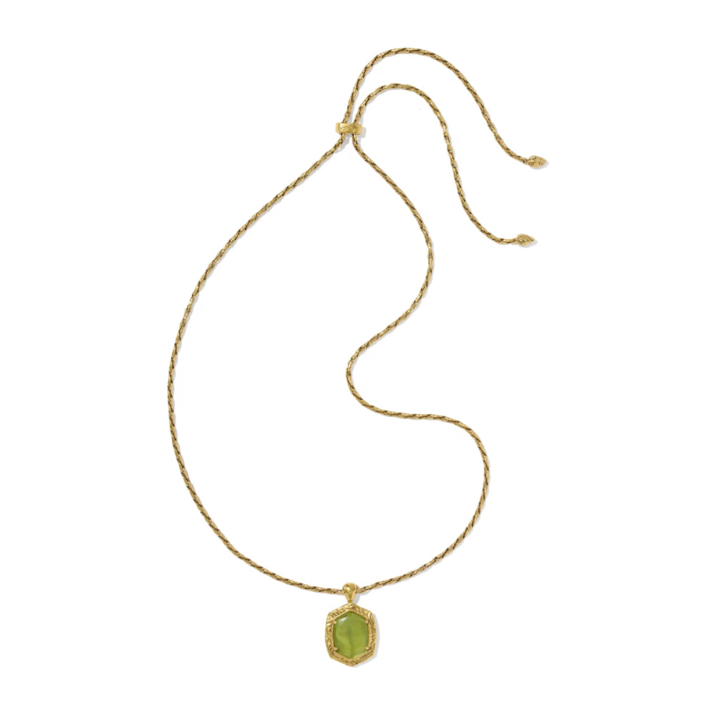A delicate gold rope chain necklace with a small hexagonal green gemstone pendant, displayed on a clean white background.