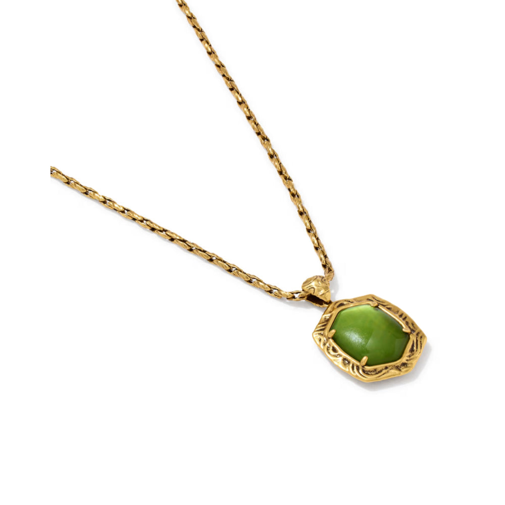 A gold chain necklace with a textured gold pendant holding a smooth, rounded green cabochon stone, shown on a plain white background.