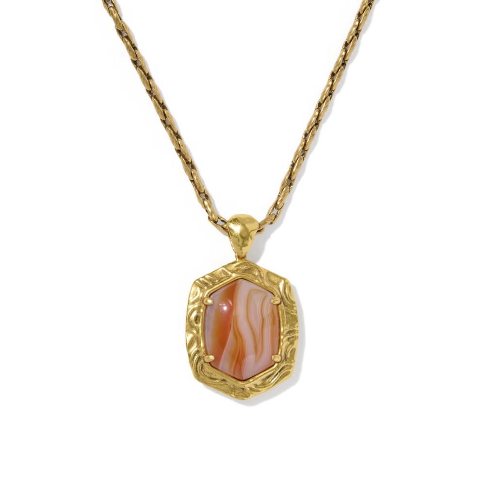 A gold chain necklace with a textured gold pendant featuring a rectangular cabochon stone with pink, orange, and white wavy patterns, set against a plain white background.