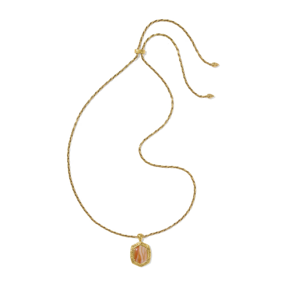 A delicate gold rope chain necklace with a small shield-shaped pendant featuring a pinkish-orange inlay, displayed on a clean white background.