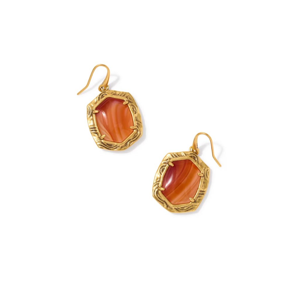 A pair of gold drop earrings featuring organic-shaped orange and red agate stones in textured gold bezels, shown on a plain white background.