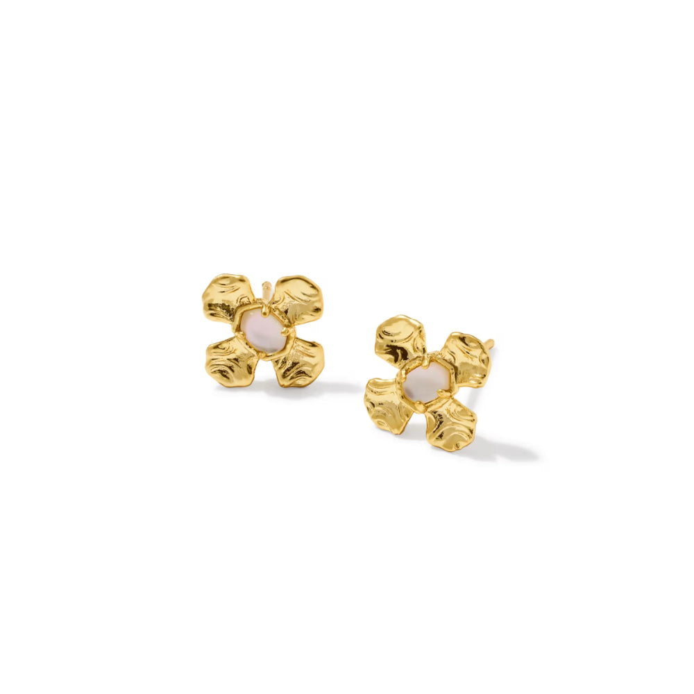A pair of gold flower-shaped stud earrings with textured petals and pale pink centers, set against a plain white background.