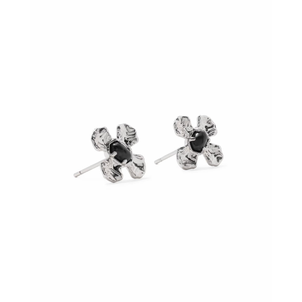 A pair of silver flower stud earrings with textured petals and a central black oval stone, shown on a plain white background.