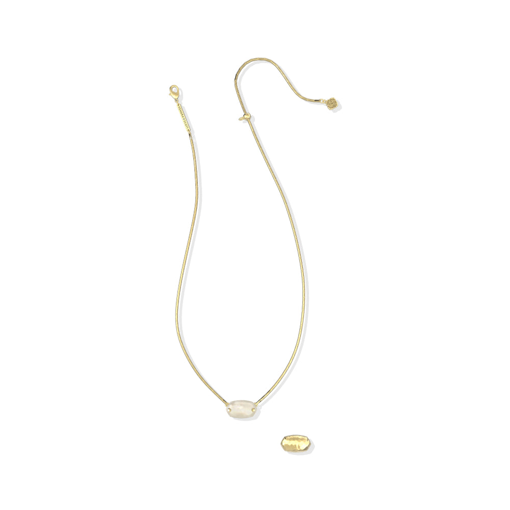 A delicate gold chain necklace featuring a small oval clear stone pendant and a separate small oval charm, displayed on a clean white background.