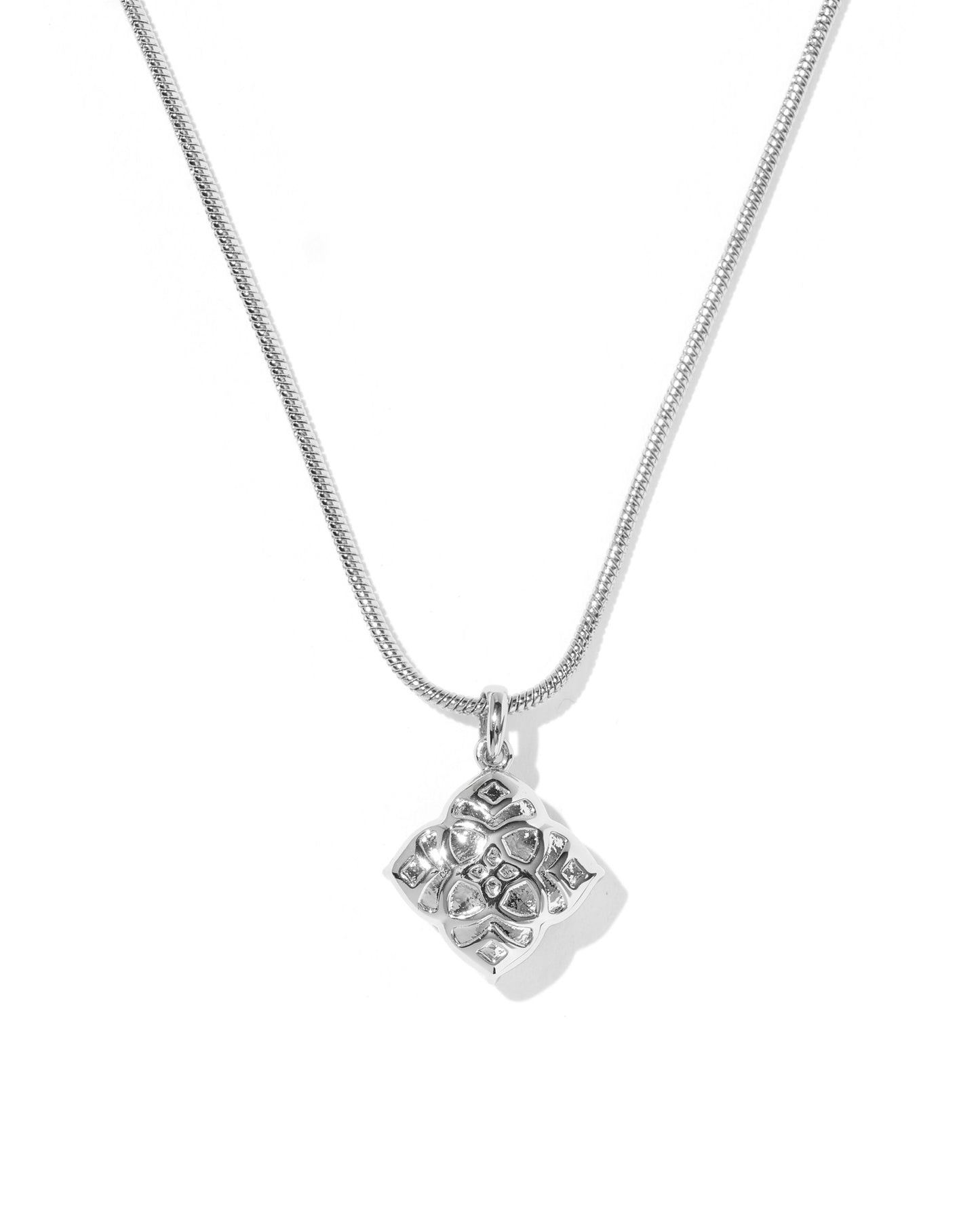 Silver necklace with a square pendant on a white background