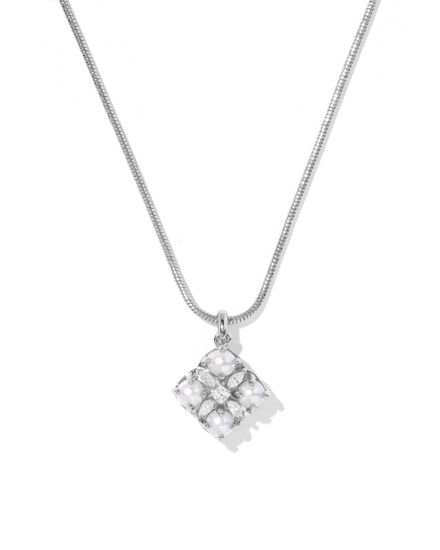 Silver necklace with a square pendant on a white background