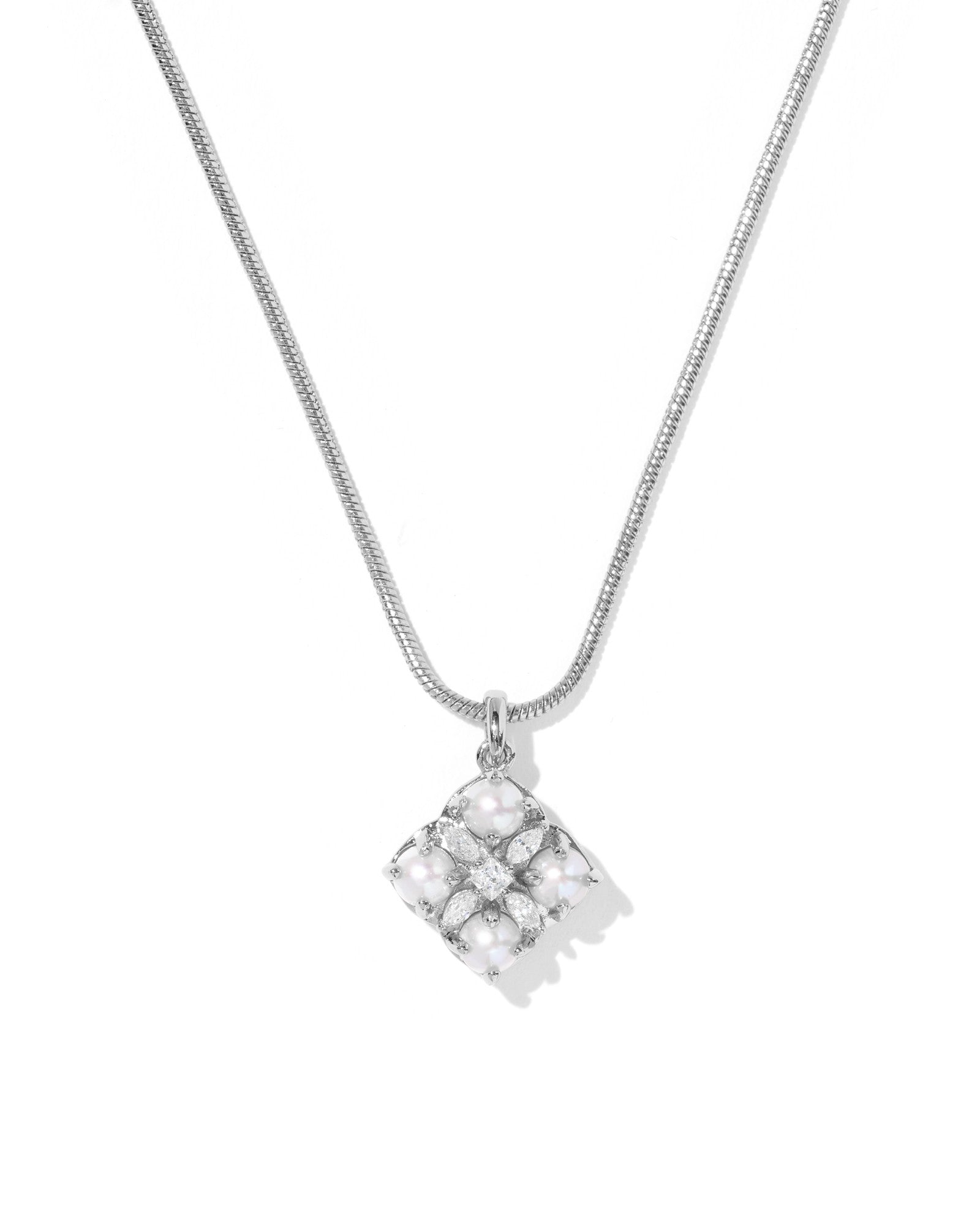 Silver necklace with a square pendant on a white background