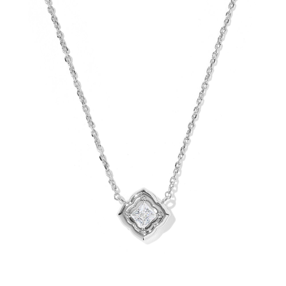 A silver necklace with a geometric diamond-shaped pendant featuring a clear central gemstone, shown on a plain white background.