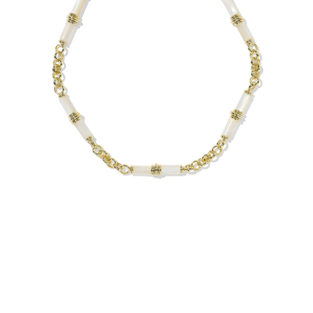 A delicate gold chain necklace featuring alternating white cylindrical beads and small gold spacer rings, displayed on a clean white background.