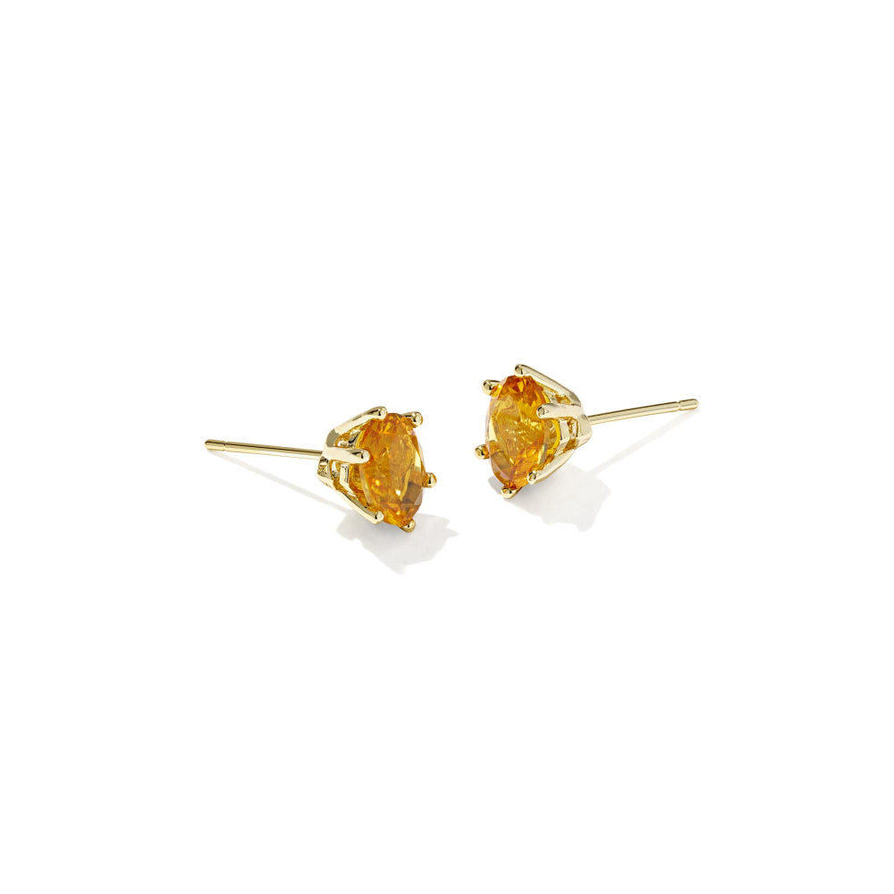 Pair of yellow gemstone stud earrings on a white background