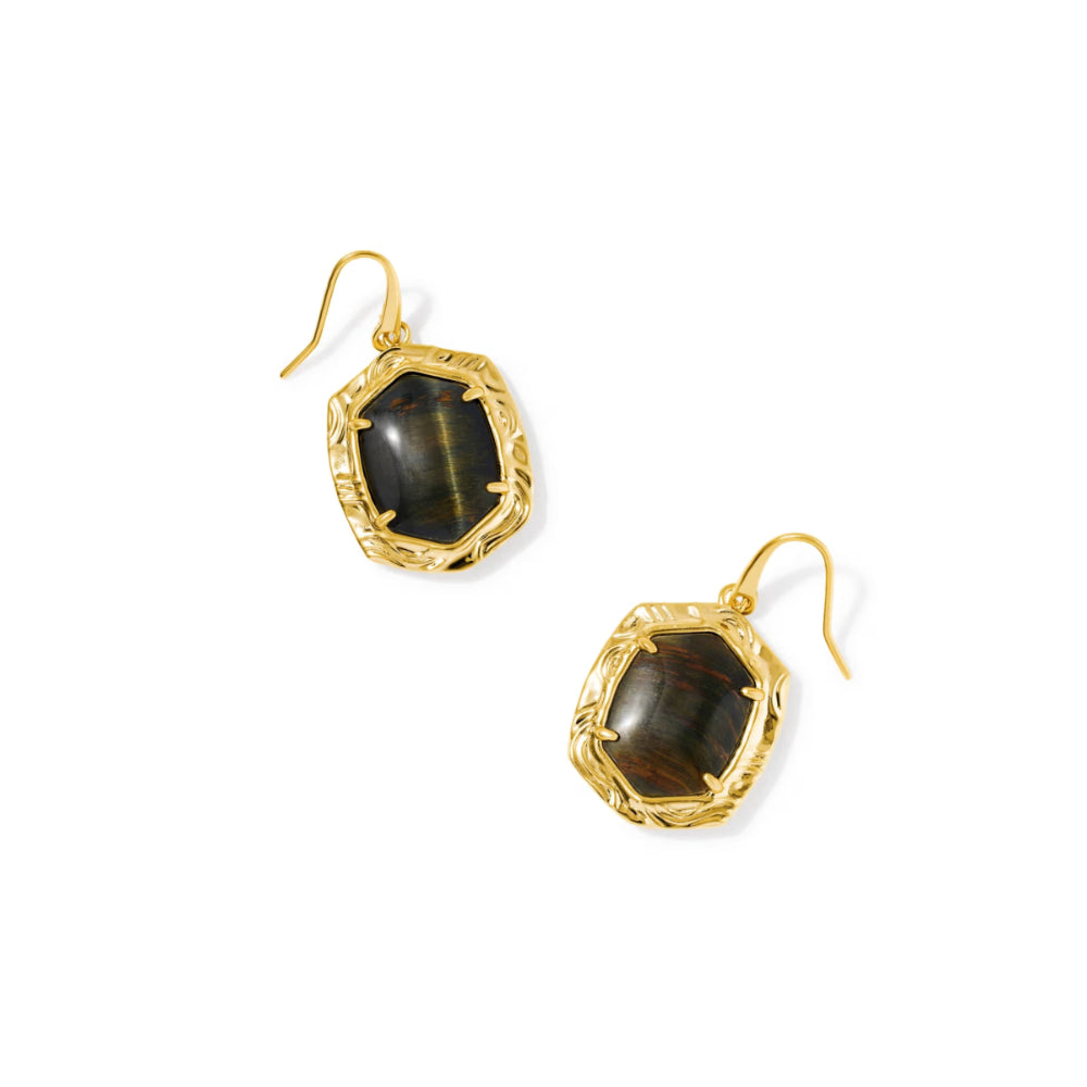A pair of gold drop earrings featuring textured, faceted gold bezels holding dark brown and black tiger's eye stones, shown on a plain white background.