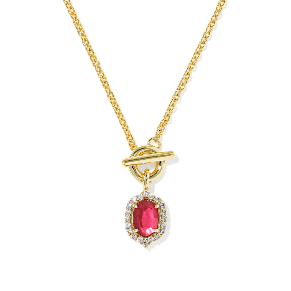 A gold chain necklace with a toggle clasp and a teardrop-shaped pink gemstone pendant surrounded by small clear stones, shown on a plain white background.