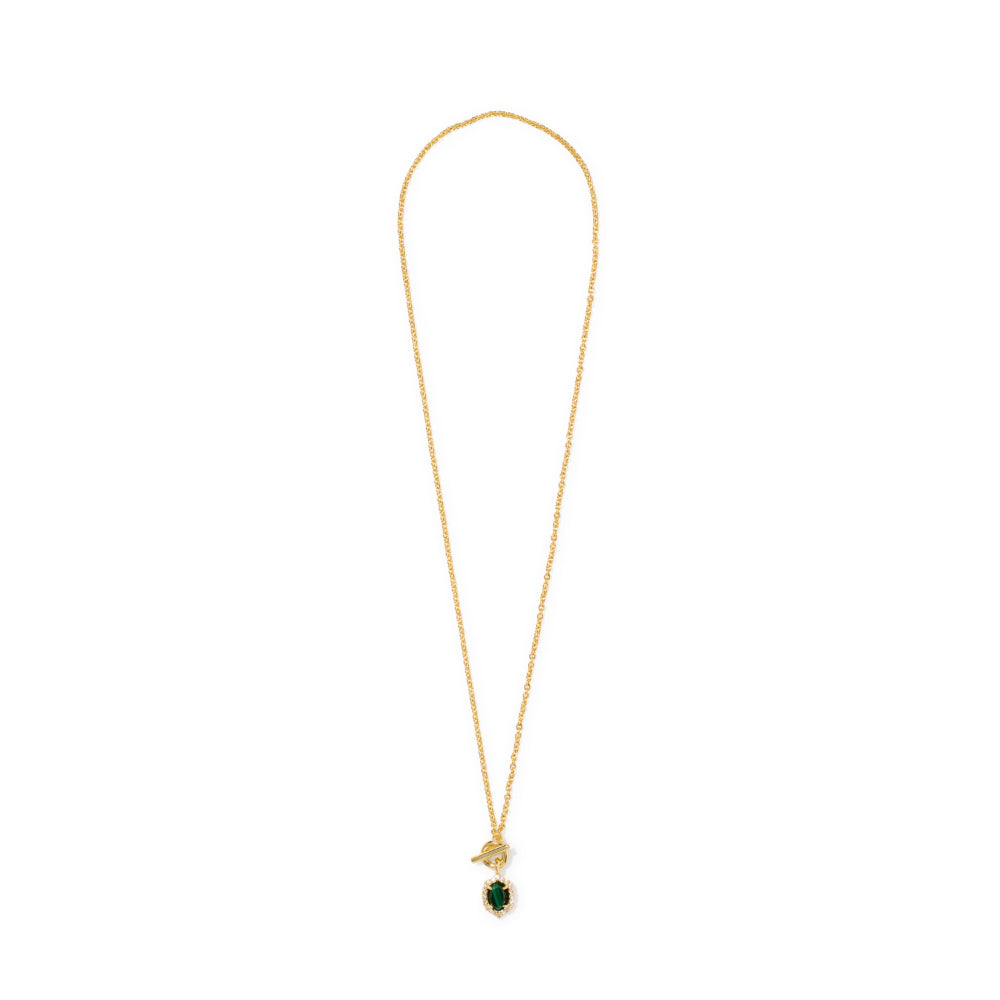 A delicate gold chain necklace featuring a small gold pendant with a green gemstone, displayed against a solid white background.