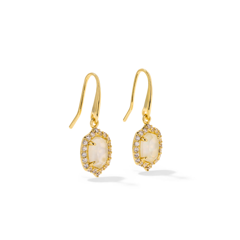 A pair of gold drop earrings featuring oval milky white gemstones surrounded by small clear stones, shown on a clean white background.