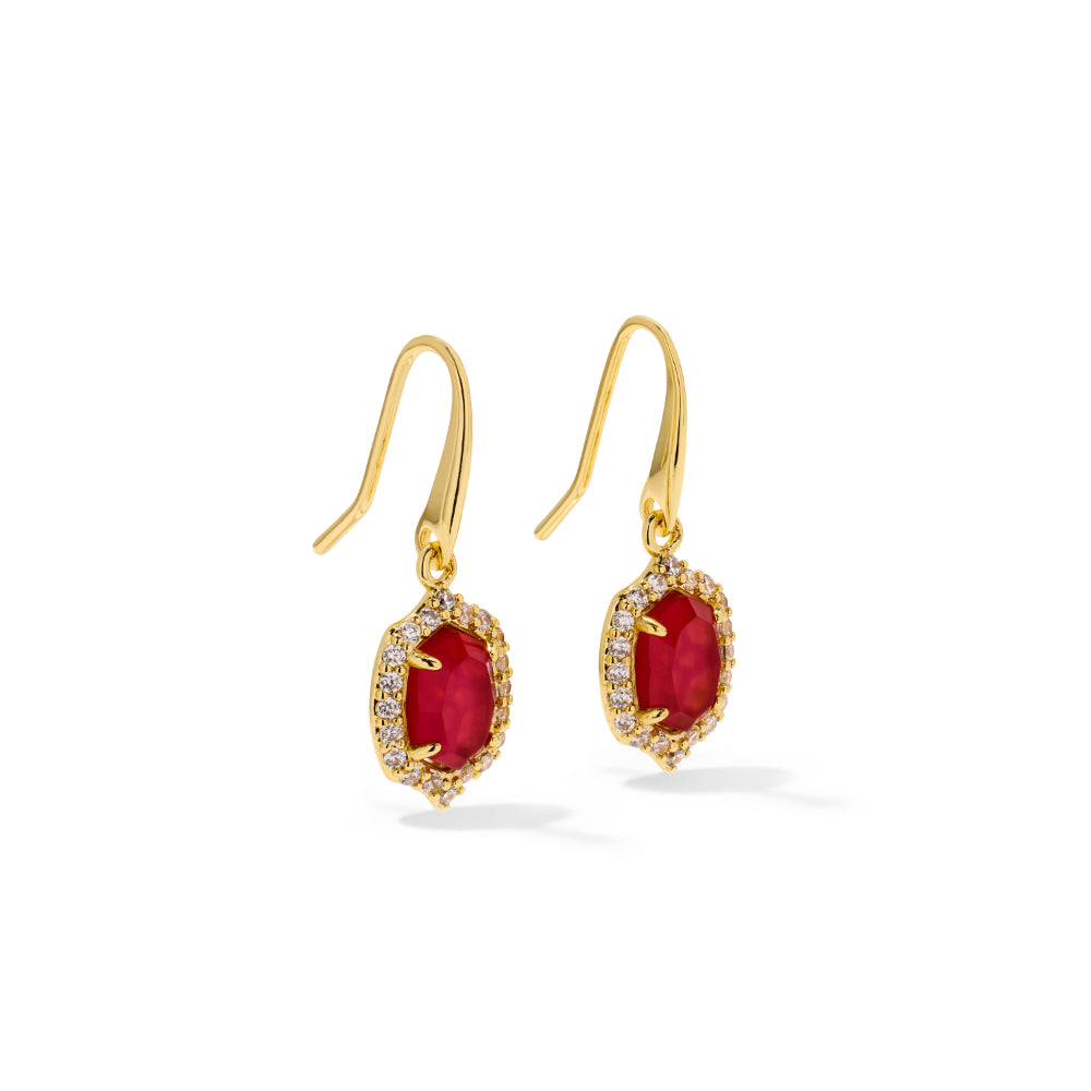 A pair of gold drop earrings featuring oval-cut red gemstones surrounded by small clear stones, shown on a clean white background.