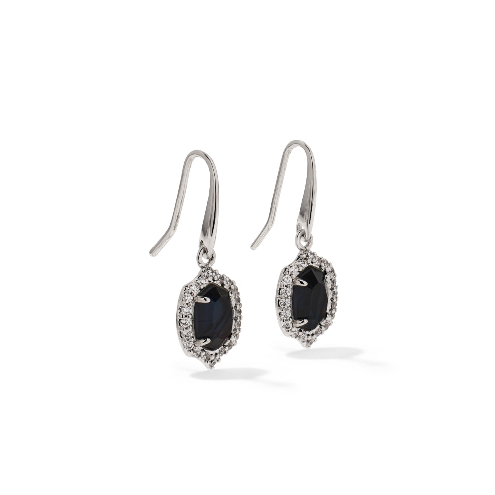 A pair of silver-toned drop earrings featuring oval dark blue gemstones surrounded by small clear pavé stones, shown on a clean white background.