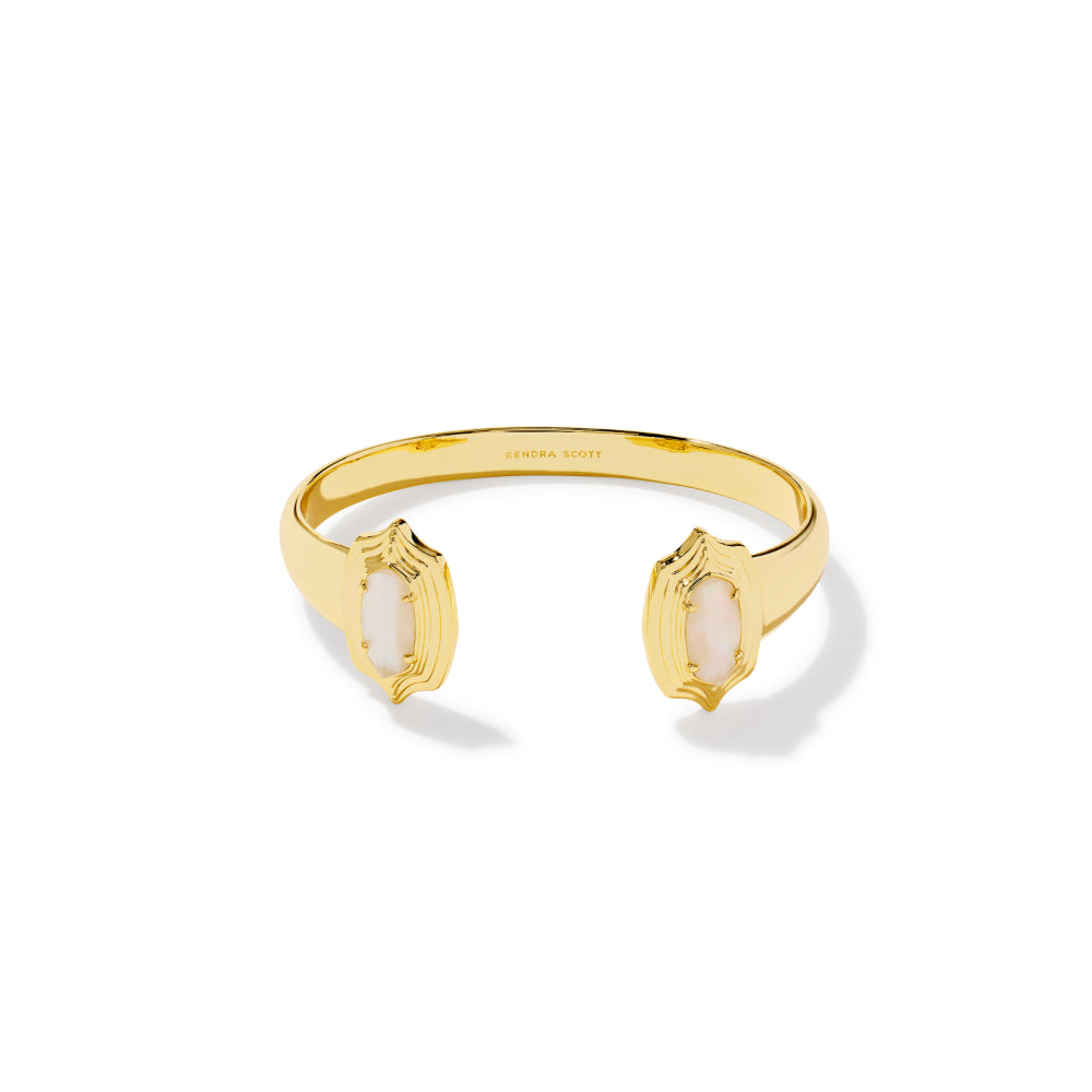 A gold open cuff bracelet with two marquise-shaped white opal inlays, shown on a clean white background with a soft shadow.