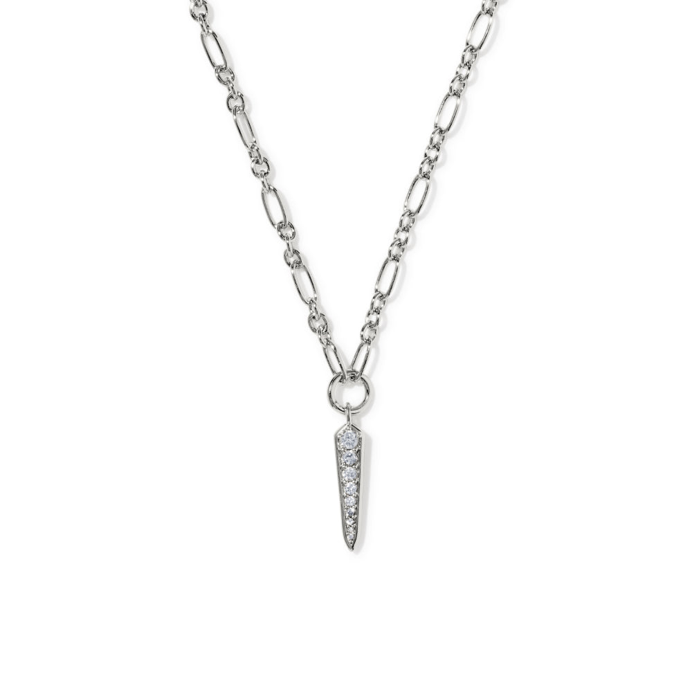 A silver Figaro chain necklace with a pointed spike pendant paved with small clear stones, shown on a plain white background.