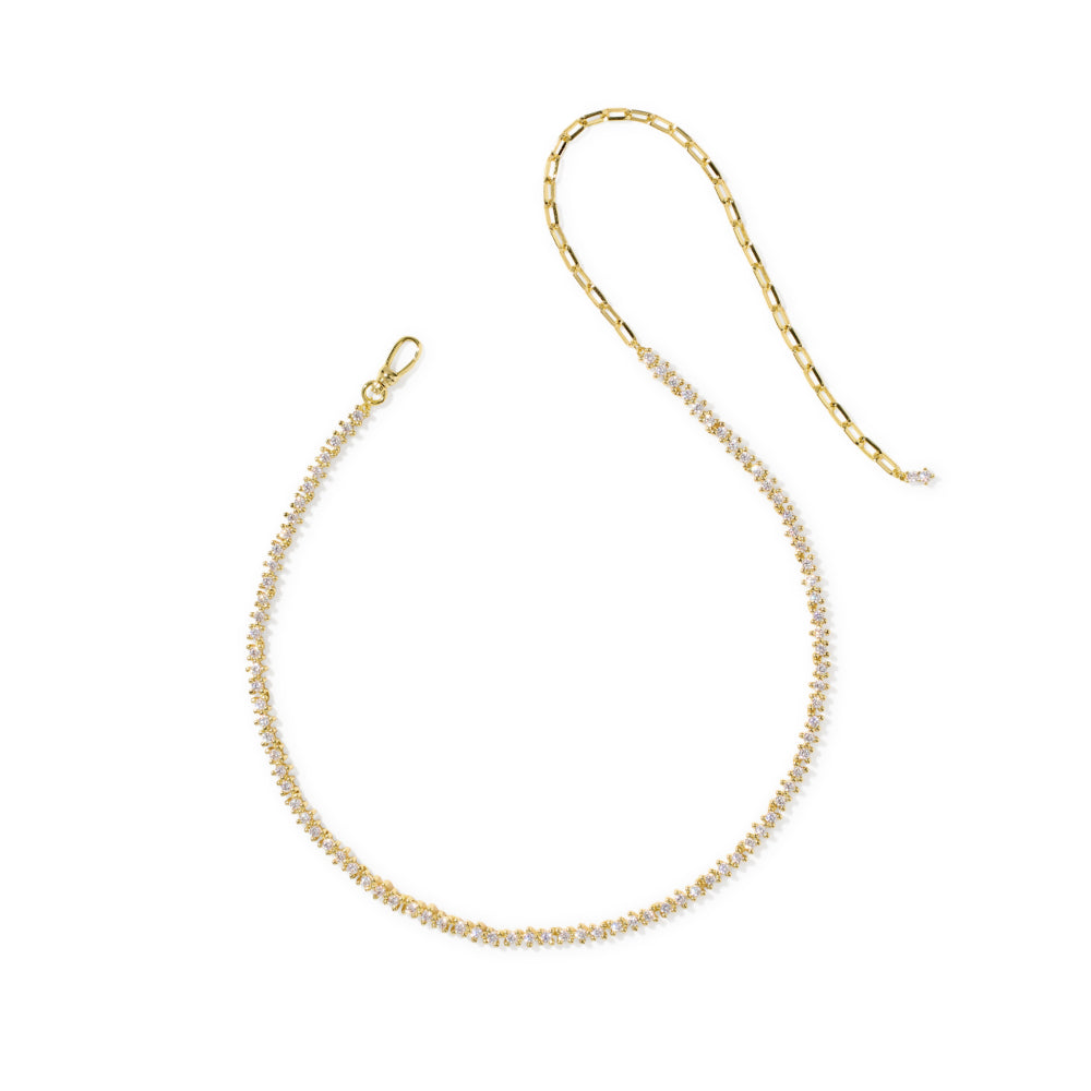 A delicate gold chain necklace featuring a single row of small, clear round-cut stones along the lower portion, displayed on a clean white background.
