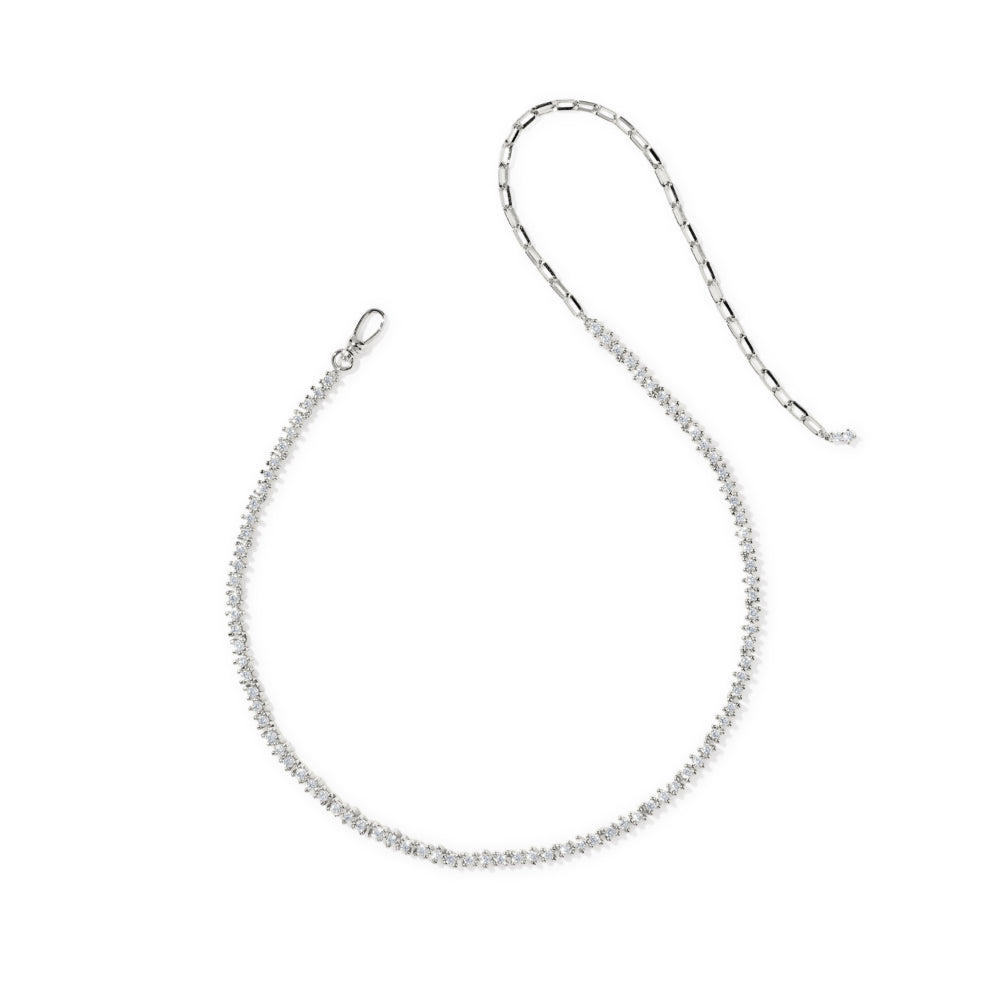 A delicate silver chain necklace with a textured, beaded appearance, featuring a lobster clasp on one end and a spring ring clasp on the other, displayed on a clean white background.