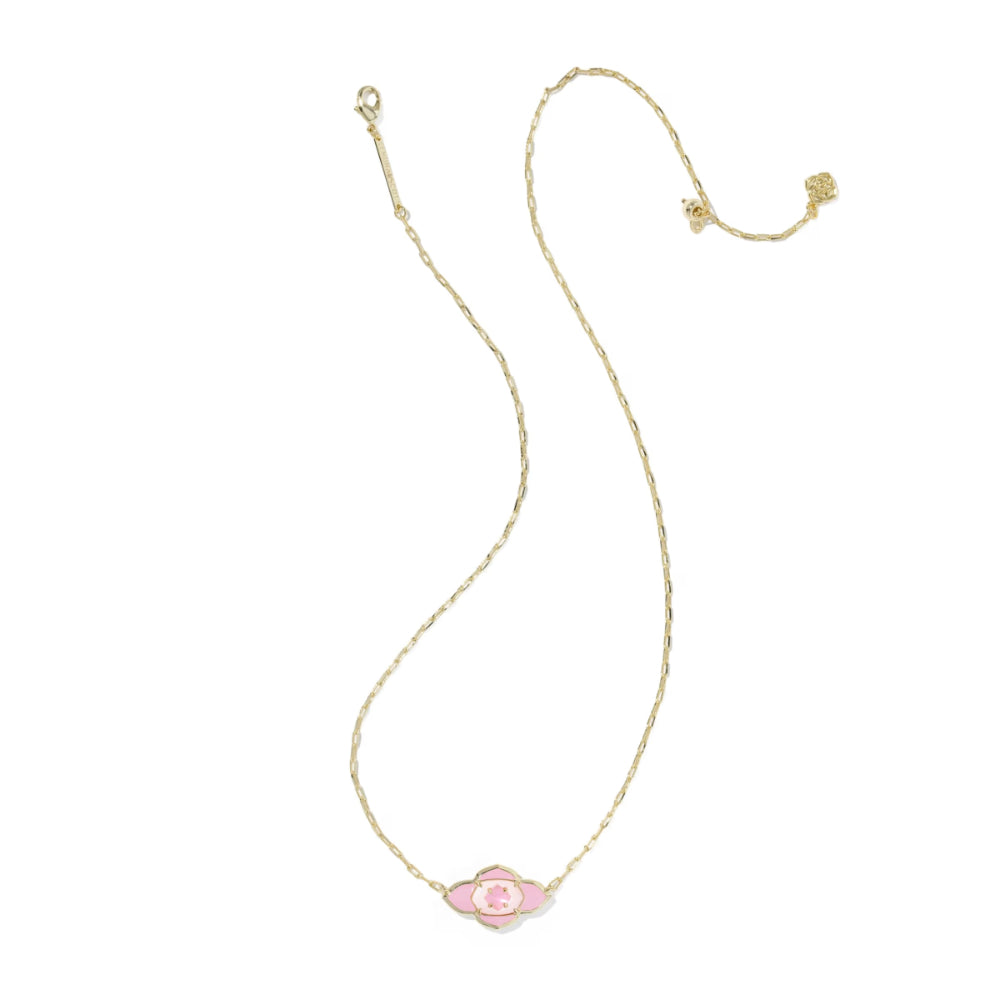 Gold necklace with a pink flower pendant on a white background