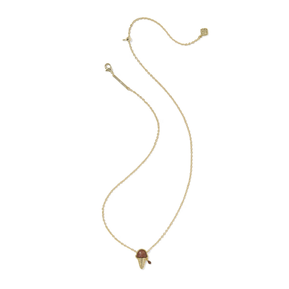 Gold necklace with a brown pendant on a white background