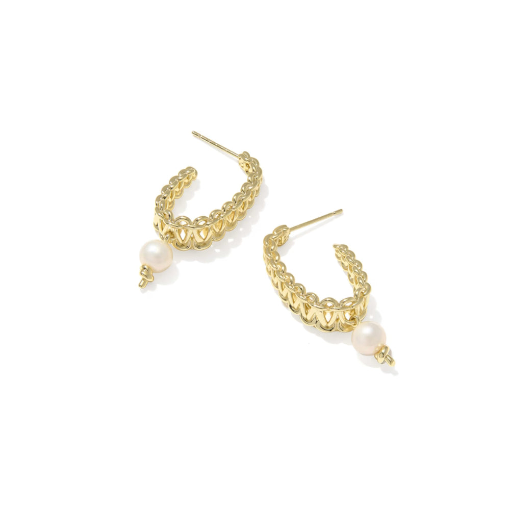 Pair of hoop earrings with pearl accents on a white background