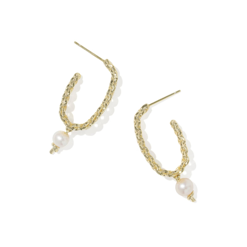 Gold hoop earrings with pearl accents on a white background