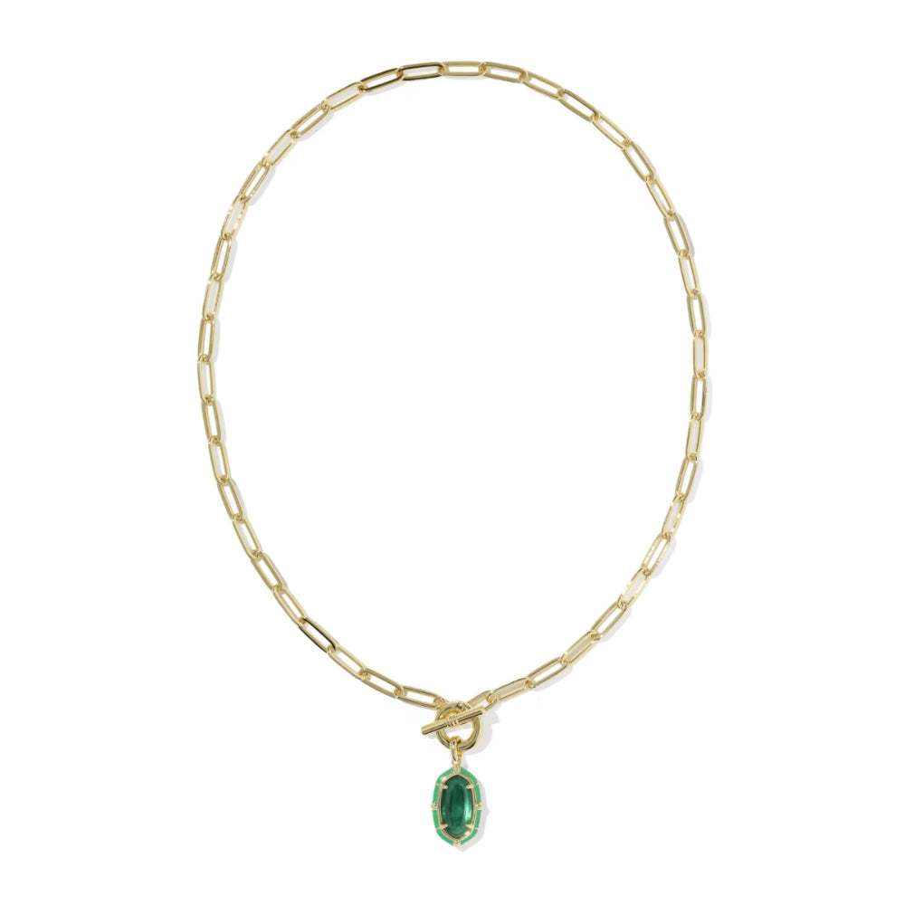 A gold paperclip chain necklace with a toggle clasp and a small oval green gemstone pendant, shown on a plain white background.