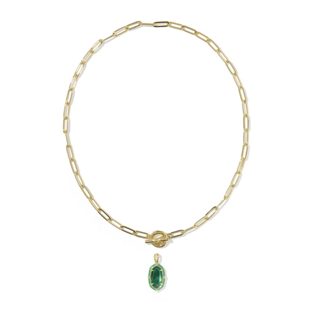 A gold paperclip chain necklace with a toggle clasp and a small oval green emerald-cut pendant, shown on a plain white background.