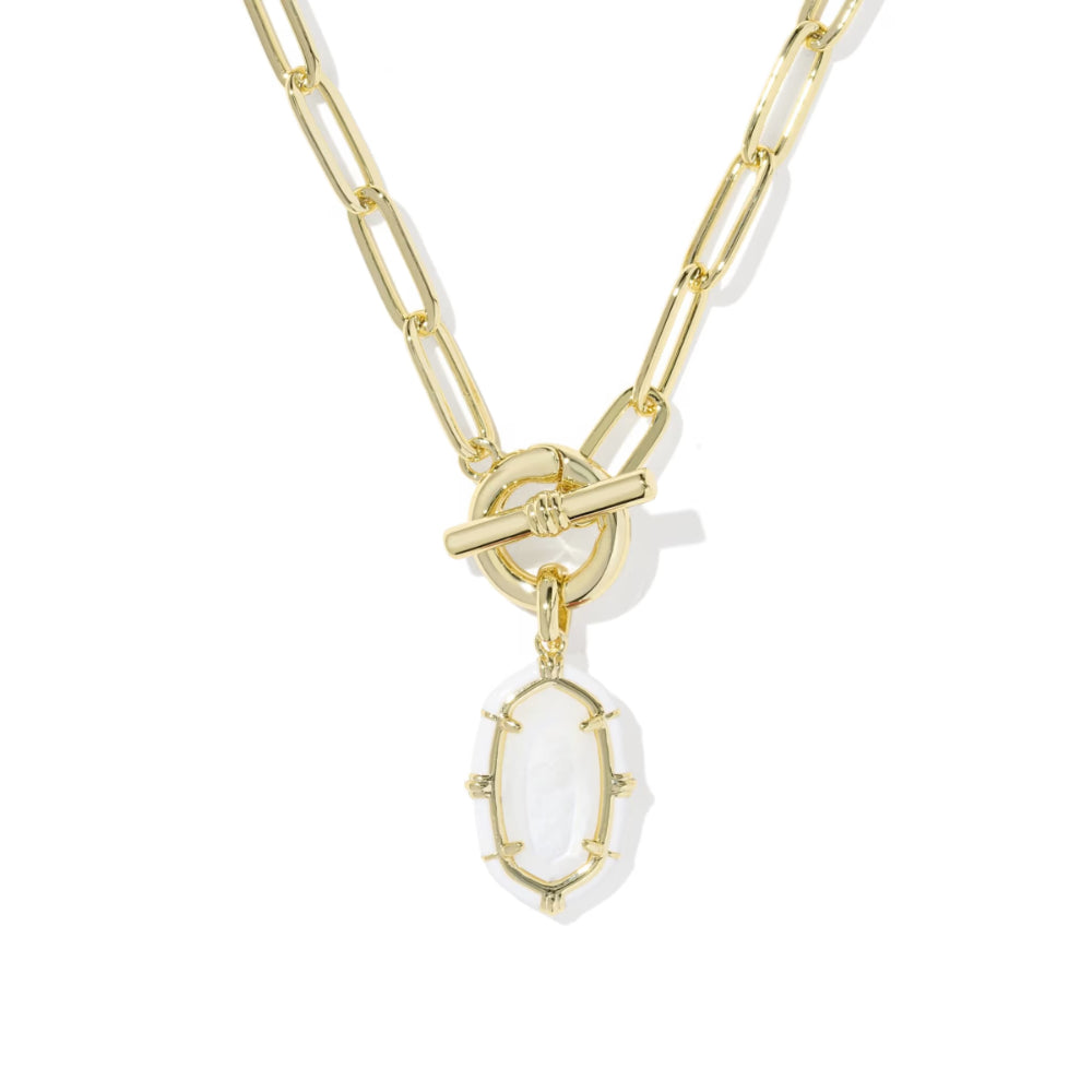 A gold paperclip chain necklace with a toggle clasp and a dangling oval clear stone pendant, shown on a white background.